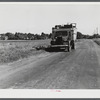 A truck on the road in the Pine Camp expansion area moving out a family's belongings. New York.