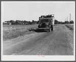A truck on the road in the Pine Camp expansion area moving out a family's belongings. New York.