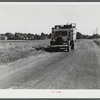 A truck on the road in the Pine Camp expansion area moving out a family's belongings. New York.