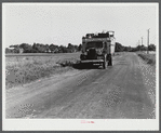 A truck on the road in the Pine Camp expansion area moving out a family's belongings. New York.