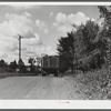 A truck on the road in Pine camp expansion area moving out a family's belongings. New York.