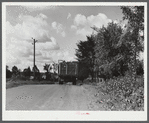A truck on the road in Pine camp expansion area moving out a family's belongings. New York.