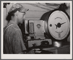 Weighing the milk at the United Farmers' Co-op Creamery in East Berkshire, Vermont.