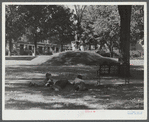 Boys lounging in the square in Enosburg Falls, Vermont.