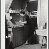 Mrs. W. Gaynor canning tomatoes on their farm near Fairfield, Vermont.