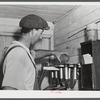 Mr. William Gaynor, FSA (Farm Security Administration) dairy farmer in his milk house on their farm near Fairfield, Vermont.