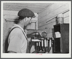 Mr. William Gaynor, FSA (Farm Security Administration) dairy farmer in his milk house on their farm near Fairfield, Vermont.