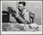 William Gaynor gets several farm journals at his home near Fairfield, Vermont.