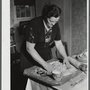 Mrs. Gaynor making doughnuts on her farm near Fairfield, Vermont.