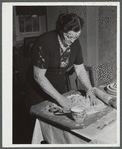 Mrs. Gaynor making doughnuts on her farm near Fairfield, Vermont.