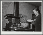 Mrs. W. Gaynor preparing dinner on their farm near Fairfield, Vermont.