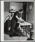 Mrs. Gaynor doing her ironing on their farm. Fairfield, Vermont.