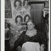 Mrs. H.H. Morey of Chelsea, Vermont, at the millinery and dressmaking exhibit in the antique building at the World's Fair. Tunbridge, Vermont.