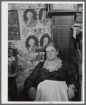 Mrs. H.H. Morey of Chelsea, Vermont, at the millinery and dressmaking exhibit in the antique building at the World's Fair. Tunbridge, Vermont.