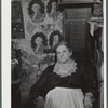 Mrs. H.H. Morey of Chelsea, Vermont, at the millinery and dressmaking exhibit in the antique building at the World's Fair. Tunbridge, Vermont.