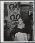 Mrs. H.H. Morey of Chelsea, Vermont, at the millinery and dressmaking exhibit in the antique building at the World's Fair. Tunbridge, Vermont.
