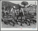 Farmers at the exhibit of old ploughs and farm implements at the World's Fair in Tunbridge, Vermont.