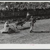 Secretary of the fair clowns for spectators at the end of the parade at the World's Fair. Tunbridge, Vermont.