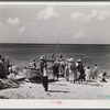 Frederiksted, Saint Croix Island, Virgin Islands. Housewives at the seashore waiting for the fishing boats to come in.