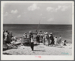 Frederiksted, Saint Croix Island, Virgin Islands. Housewives at the seashore waiting for the fishing boats to come in.