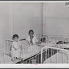 Frederiksted, Saint Croix, Virgin Islands. Child on the left, in the children's ward of the Frederiksted hospital, is suffering from severe malnutrition.