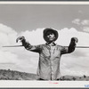 Guanica, Puerto Rico (vicinity). An ox cart driver with a staff used for directing the oxen in a sugar field.