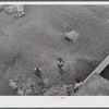 San Sebastian, Puerto Rico (vicinity). Children playing in a contaminated river.