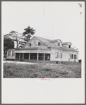 Santurce, Puerto Rico (vicinity). A house on the property which FSA (Farm Security Administration) is buying for a land and utility housing project.