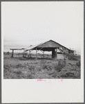 Santurce, Puerto Rico (vicinity). A barn on the property which FSA (Farm Security Administration) is buying for a land and utility housing project.
