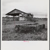 Santurce, Puerto Rico (vicinity). Watering trough and barn on property which FSA (Farm Security Administration) is buying for a land and utility housing project.