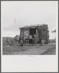 Santurce, Puerto Rico (vicinity). A house on the property which FSA (Farm Security Administration) is buying for a land and utility housing project.