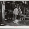 Sheffield, Alabama. Reynolds Alloys Company. Rolling cold aluminum sheets.