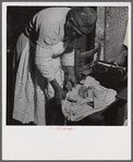 Midwife wrapping her kit to go on a call in Greene County, Georgia.