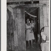Saint Croix Island, Virgin Islands. Puerto Rican woman and her children, FSA (Farm Security Administration) borrower, living in the slum village of "Barren Spot".