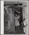 Saint Croix Island, Virgin Islands. Puerto Rican woman and her children, FSA (Farm Security Administration) borrower, living in the slum village of "Barren Spot".