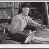 Frederiksted (vicinity), Saint Croix Island, Virgin Islands. Puerto Rican farmer grinding corn with stones he brought with him from Puerto Rico.