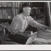 Frederiksted (vicinity), Saint Croix Island, Virgin Islands. Puerto Rican farmer grinding corn with stones he brought with him from Puerto Rico.