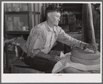 Frederiksted (vicinity), Saint Croix Island, Virgin Islands. Puerto Rican farmer grinding corn with stones he brought with him from Puerto Rico.