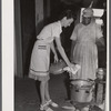 Frederiksted (vicinity), Saint Croix Island, Virgin Islands. Miss Tippin, FSA (Farm Security Administration) home demonstration agent, teaching a FSA borrower how to use a pressure cooker.