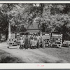 FSA (Farm Security Administration) family with the 1000 cans of fruit, vegetables, etc. they have canned for the winter. Near White Plains, Greene County, Georgia.