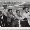 Boyd Jones, playing tug-of-war with class mates during play period at the Alexander Community School in Greene County, Georgia.