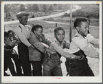 Boyd Jones, playing tug-of-war with class mates during play period at the Alexander Community School in Greene County, Georgia.