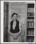 Mrs. Ira C. Brown with her canned goods. FSA (Farm Security Administration) clients. Her husband built the cupboard. Union Point, Greene County, Georgia.