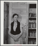 Mrs. Ira C. Brown with her canned goods. FSA (Farm Security Administration) clients. Her husband built the cupboard. Union Point, Greene County, Georgia.