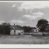 One of the new houses being built for FSA (Farm Security Administration) to replace some of the old, like the one at the left. Near Carey Station, Greene County, Georgia.
