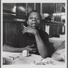 James Baldwin with cigarette and teacup