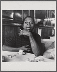 James Baldwin with cigarette and teacup