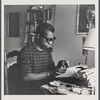 James Baldwin at typewriter