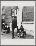 James Baldwin getting a shoeshine