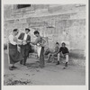 James Baldwin sitting next to boy on Istanbul street
